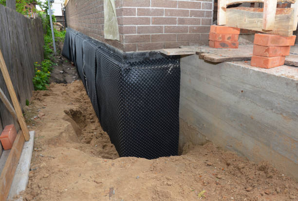 Happy homeowners after waterproofing job in Macomb